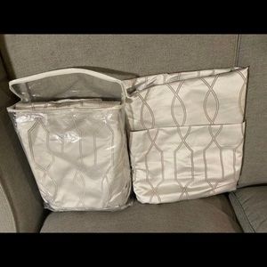 Two 96 inch long curtain panels (silver). Like new condition